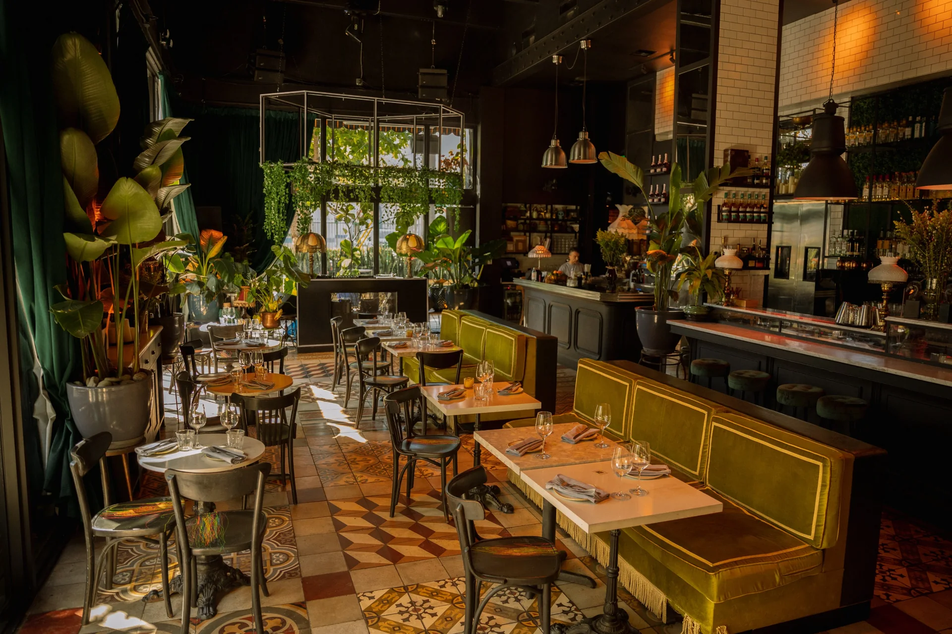 Dining room and bar with green velvet seating at SHA Wynwood