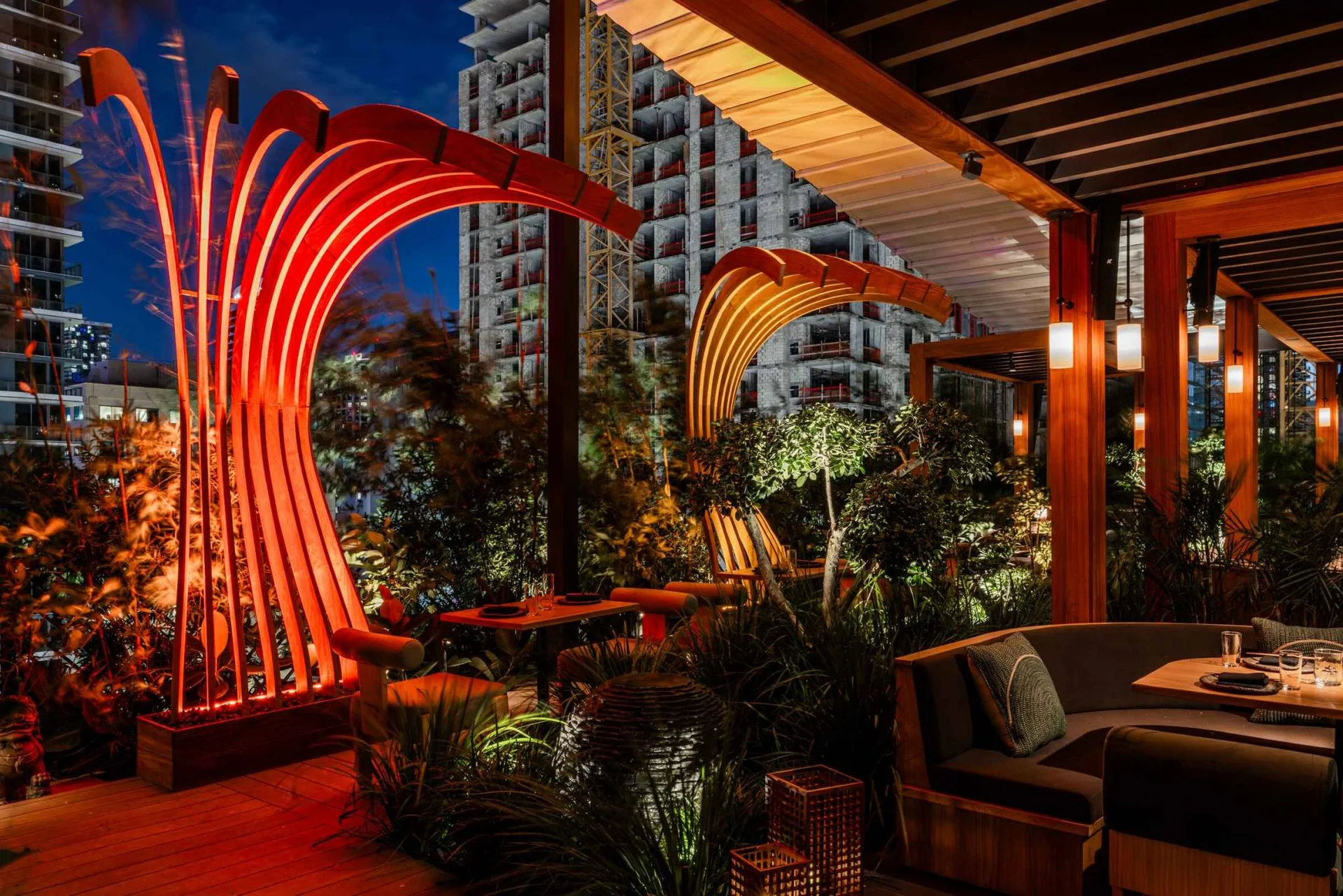 Sculptural rooftop terrace and dining tables at Yamashiro Miami at dusk