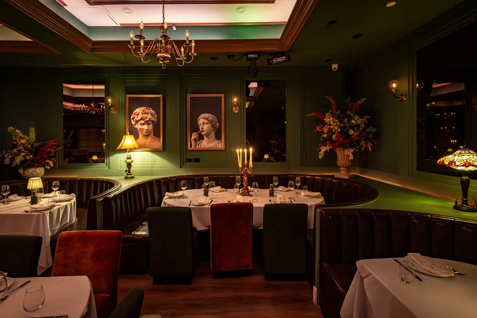Green dining room and curved banquettes at Leonardo Miami Beach
