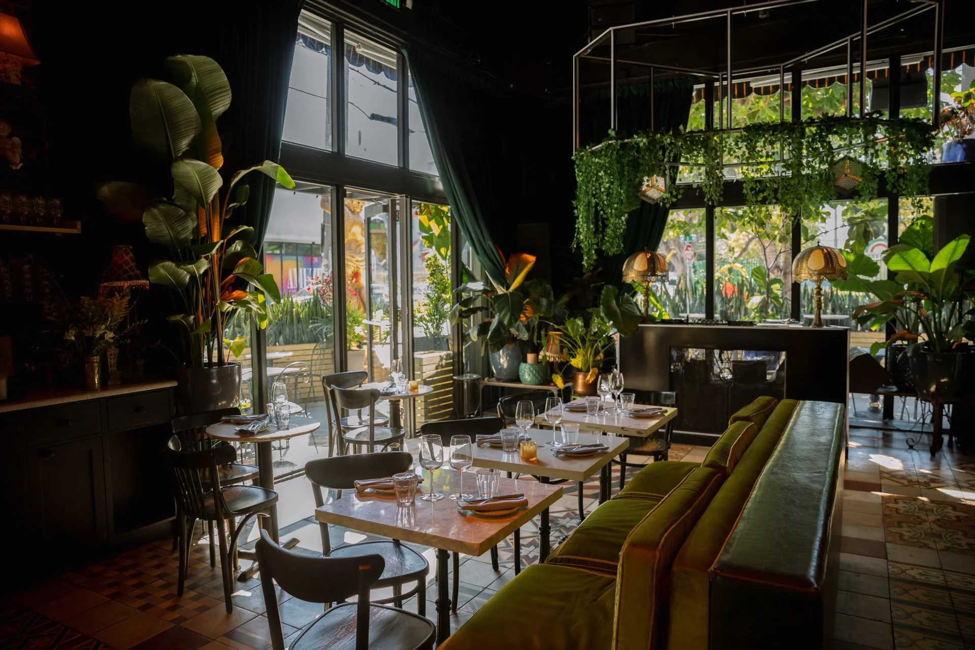 Sunlit dining tables and tall windows at SHA Wynwood